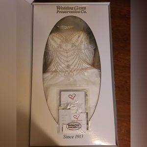 Brand new in the box wedding dress, veil and tiara.